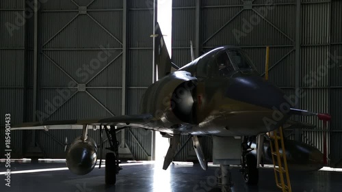 Fighter Jet Inside Military Hangar, Door Opening With Daylight, Dramatic Light