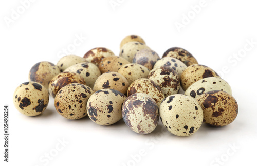 Quail eggs isolated on white background. Natural patterned farm quail eggs.