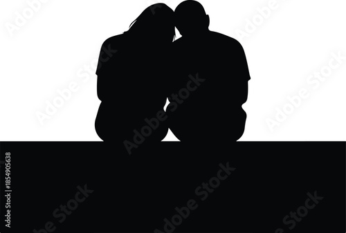 Loving couple sitting together in intimate silhouette