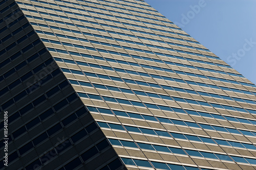 Contemporary Office Building: Clean Lines and Geometric Facade Under Clear Sky
