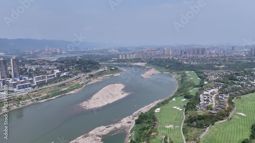 Wallpaper Mural Aerial Golf Course by River with City Skyline and Mountains Torontodigital.ca