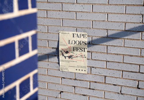 Blank A4 Paper Poster on a Brick Wall. PSD template mockup.