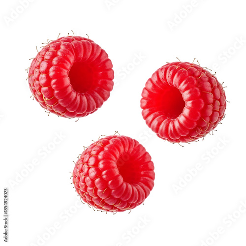 Three red raspberries floating on transparent background
