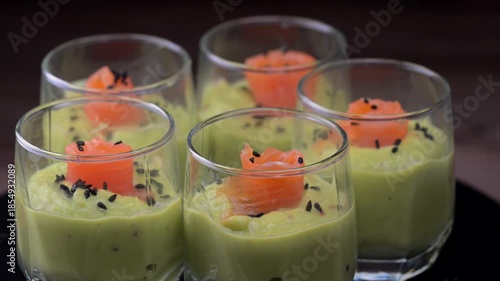 Smoked salmon shot glasses guacamole served with homemade crackers. High quality video