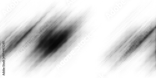 Dynamic abstract black and white halftone patterns forming two irregular dark smudges on a light background.