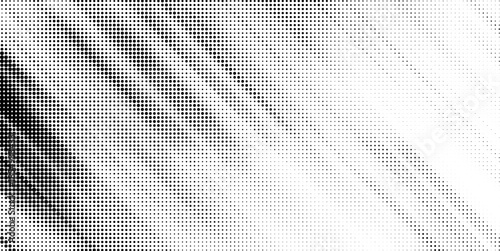 An abstract halftone gradient effect smoothly transitioning from dense black dots to pure white space.