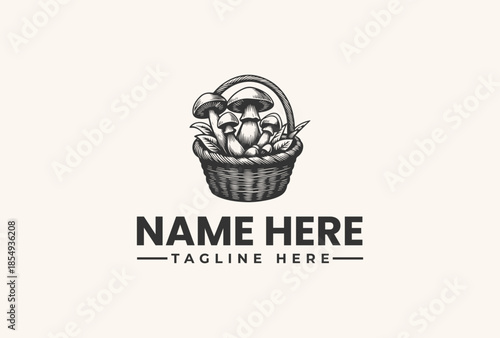 A black and white illustration of a wicker basket filled with various vegetables and mushrooms on a clean white background with a placeholder text for a logo.