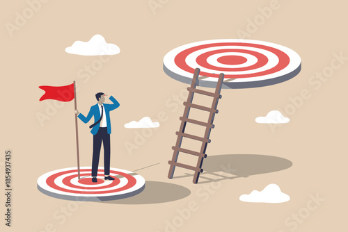 Businessman aiming for higher goals