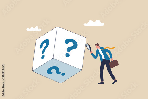 Businessman examining large question mark cube