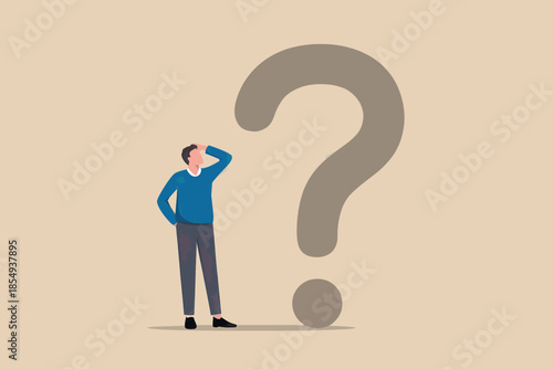 Man pondering large question mark
