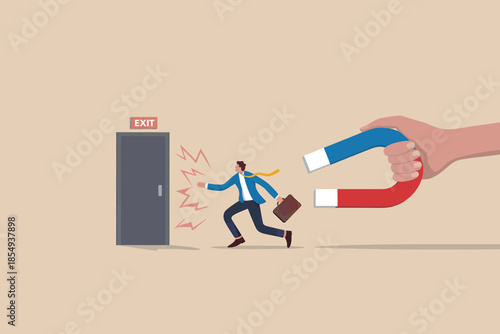Businessman drawn to exit by magnet
