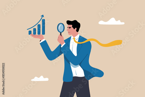 Businessman examining growth chart