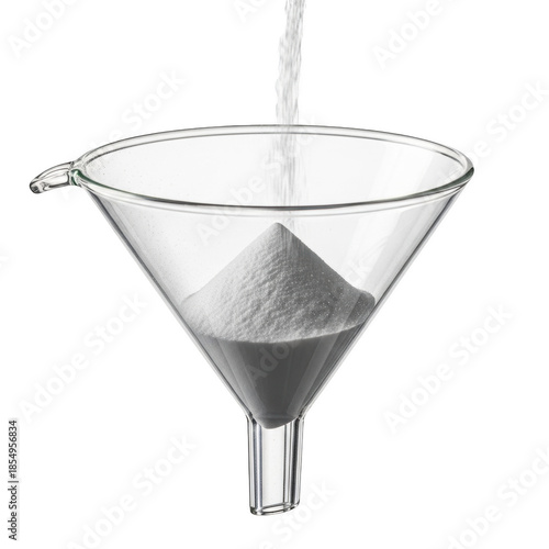 White powder pouring into glass funnel against black background image