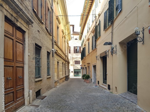 Narrow street in the old town of Bologna, Italy
