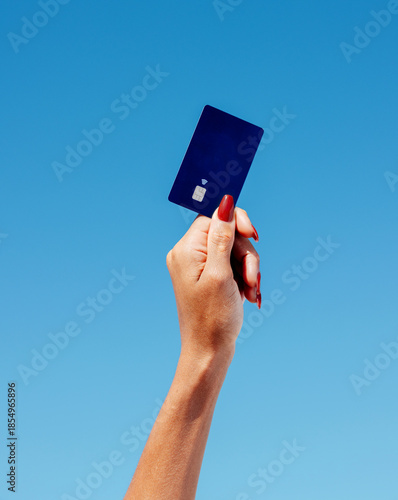 Woman hand holding contactless bank card. Payment technology mockup. Fintech branding, online banking promotions, credit card services, shopping ads, lifestyle finance campaigns and digital wallet