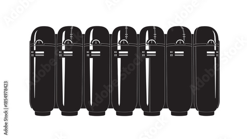 A row of black and white cylindrical objects resembling capsules or containers