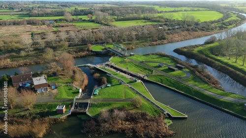 Aerial drone view of inland river canal and water control facility, sluice gates and lock gates, abstraction of water, Denver Sluice complex England UK 