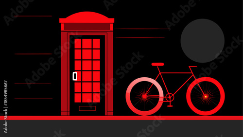 Red phone booth and bike at night