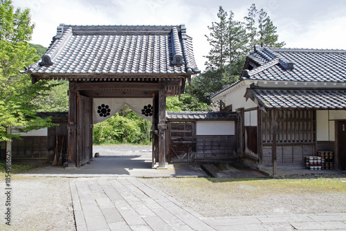 gate in a samurai's residence (aizu bukeyashiki) in aizuwakamatsu in japan 