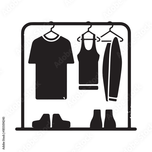 Wardrobe with clothes hanging on hangers and shoes below