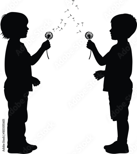 Two children silhouettes blowing dandelions with seeds flying in the air