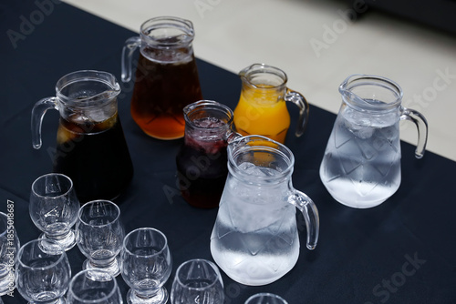 Glass Jars with Water, Drinks and Elegant Tasting Glasses