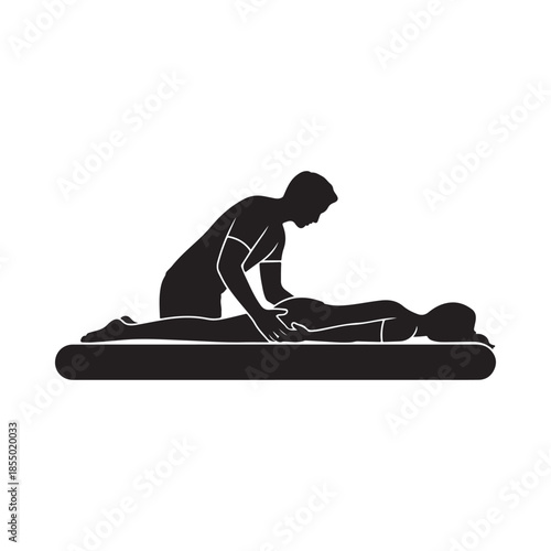 Silhouette of a massage therapist working on a client s back