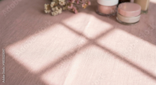 Pastel pink linen fabric with diagonal window shadow