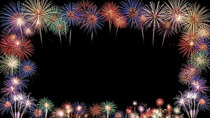 Decorative frame border made of colorful fireworks exploding on a black background with copy space