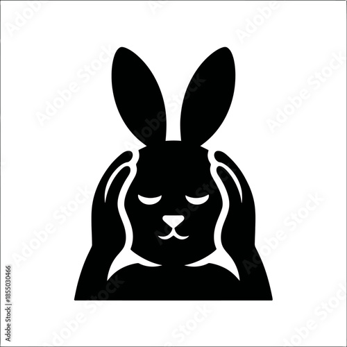 Black silhouette of a rabbit covering its ears on white background