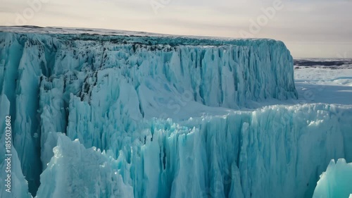 Majestic ice cliffs rise dramatically against a soft sky in a remote, frozen landscape Generative AI