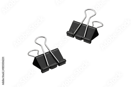 Black Binder Clips Isolated on Black Background