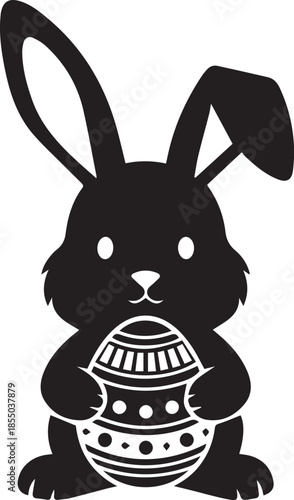 Easter bunny holding decorated egg