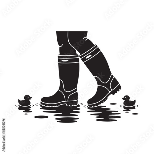 A person wearing rain boots walks with small ducklings nearby