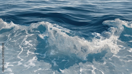 Waves rise and fall continuously on the ocean surface. The water reflects light as it moves. It is a sunny afternoon at the beach.