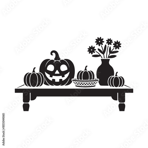 A black and white still life arrangement of pumpkins flowers and a vase