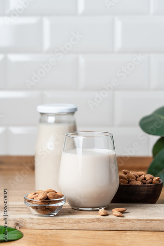 Glass of Vegan Almond Milk on Wooden Kitchen Countertop, Healthy Plant Based Nutrition Concept