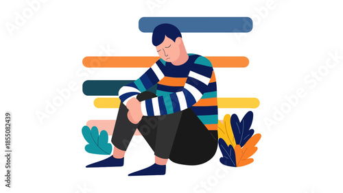 A person sits with their head down, appearing sad or contemplative.