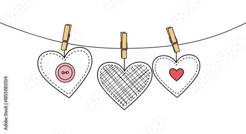 Three handmade fabric hearts are hanging on a clothesline with wooden pins against a clean white background.