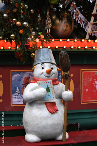 Journey to Christmas festival on Manege Square. Snowman near Christmas tree. Moscow