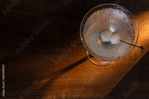 Wallpaper Mural Ice cold Gibson Martini on a bar drop with dramatic shadows and warm tones Torontodigital.ca