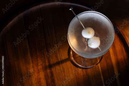 Wallpaper Mural Ice cold Gibson Martini on a bar drop with dramatic shadows and warm tones Torontodigital.ca