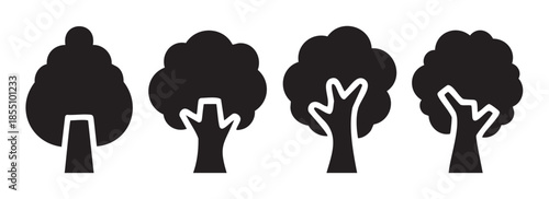 Four distinct black tree silhouette icons representing various shapes of nature's foliage and trunks, perfect for environmental and ecological design elements.