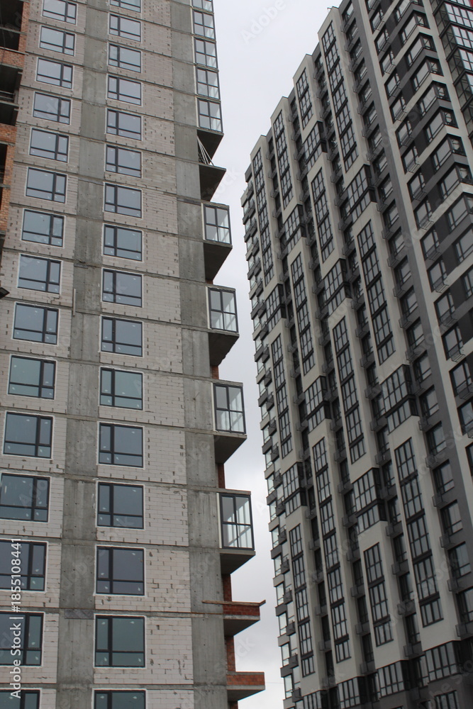 Fototapeta premium high rise apartment building, the facade of the new building