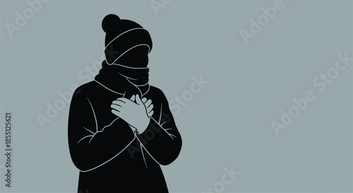 Silhouette of a person warmly dressed for cold weather hands clasped together