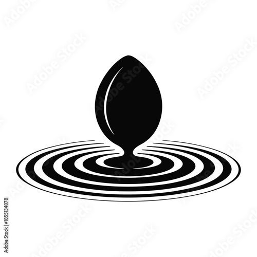 Black drop falling into water causing ripple effect isolated on