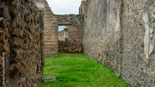 beautiful landscape from Pompeii ancient archeological excavation to Vesuvius volcano and amazing cloudy cky on background