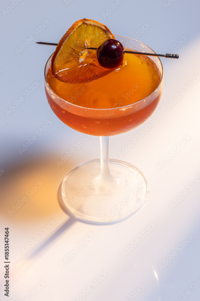 custom made wallpaper toronto digitalBeautiful amber cocktail, a Negroni or manhattan served up on a white surface with dramatic lighting.