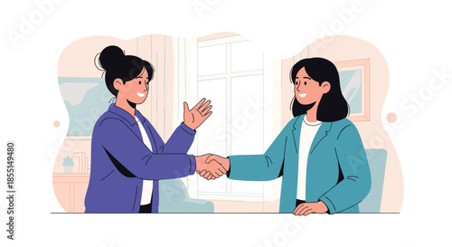 Two professional women smiling and shaking hands after reaching an agreement in a bright and modern office interior.