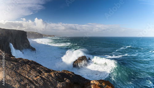 The Ocean Waves Are Crashing Against The Cliffs Creating A Beautiful